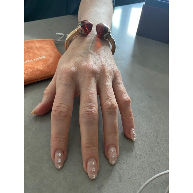 This Miriam Salat bangle features 2 tone wine color resin with vintage sterling silver. Cubic zircon full diamond facet...