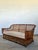 This vintage stick rattan sofa is a striking homage to the legendary designs of the Bielecky Brothers, capturing a...