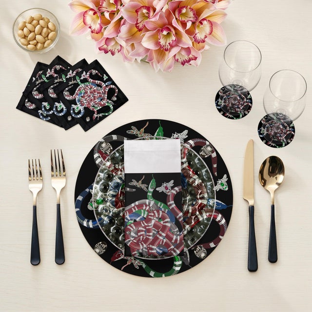 Let your table transition from classic to modern with our Ouroboros Vegan Leather Round Pebble Placemat, featuring an...