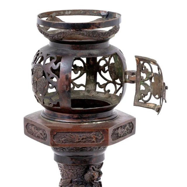 Japanese Meiji Bronze Censer, late 19th century, the globular pierced top with hinged door, on integral base cast with a...