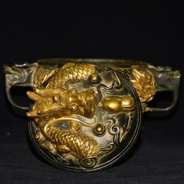 This striking decorative piece is a beautiful representation of traditional Chinese artistry. It features a heavily...