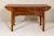 A richly carved console table with two drawers, scrolling clouds and flowers. An exquisitely detailed masterpiece, this...