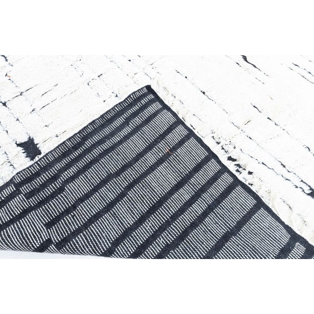 Modern Moroccan High-Low Wool Rug in Black and White by Doris Leslie Blau Size: 12'3" × 18'1" (373 × 551 cm) A striking...