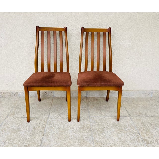 Pair of vintage chairs dating from the sixties. Velvet seat and teak structure. dimensions: h95.5 ha46 l48 d49