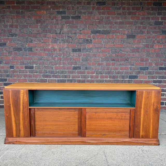 Distinctive American studio credenza attributed to Robert Whitley, showcasing a thoughtful mix of materials and sculptural...