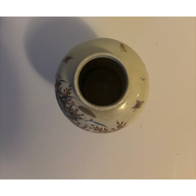 The beautiful decorative vase is believed to be a Japanese Satsuma ceramic vase with gilt decorations, likely to be from...