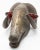 Carved wooden ram mask with brass overlay. Horns are carved wrapping the head on either side. Ears have tassels in them...