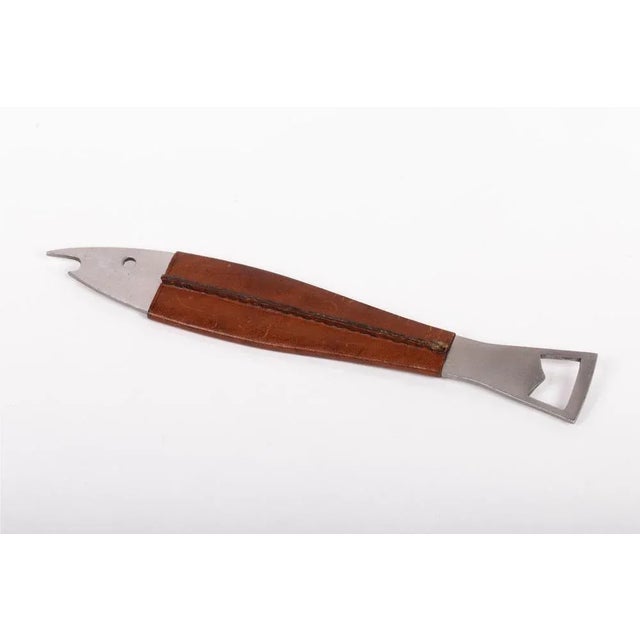 Carl Auböck set of two leather and steel bottle openers, Austria, 1960s. This piece is attributed to the mentioned...