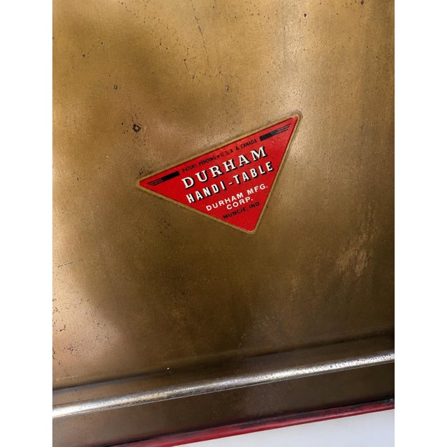 Vibrant poppy red mid-century TV tray tables with sculptural chrome wire frames and original Durham ‘Handi-Table’ labels....