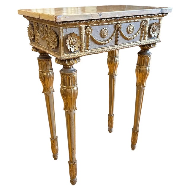 Early 19th Century Italian Parcel Gilt Neoclassical Console Table. Wonderful small size. Reeded legs, rosettes and...