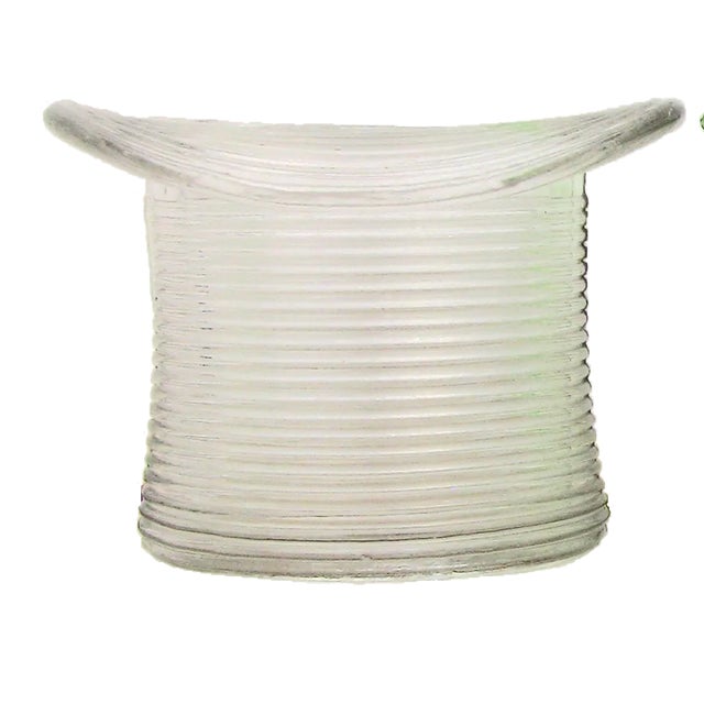 Mid 20th century colorless glass hat form match strike / pyrogene. having continuous ribbed sides onto which the match is...