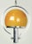 Machine age influenced modern pendant light with a beautiful amber-gold glass shade. The cased glass shade is white on the...