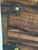 Handcrafted wood storage box made in India with dark iron strap hardware, brass-tone rivets, and front latch closure....