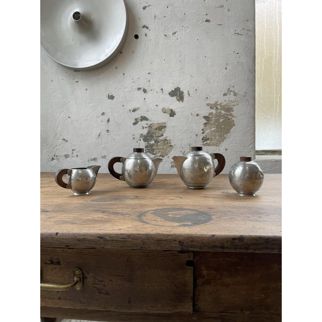 Old set consisting of a teapot, milk jar and sugar pot tin hammered by rené delavan decorator at the end of the 1920s. the...