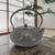 A twentieth-century Japanese Nambu cast-iron tetsubin manufactured by Oigen Chuzo Co., Ltd. of Iwate Prefecture and...