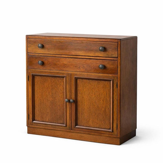 A charming 1950s oak pantry cabinet, offering practical storage and classic mid-century craftsmanship. Constructed from...