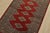 A tribal Bokhara Jaldar rug hand-knotted with fine wool on a cotton foundation. This rug features geometric medallions set...