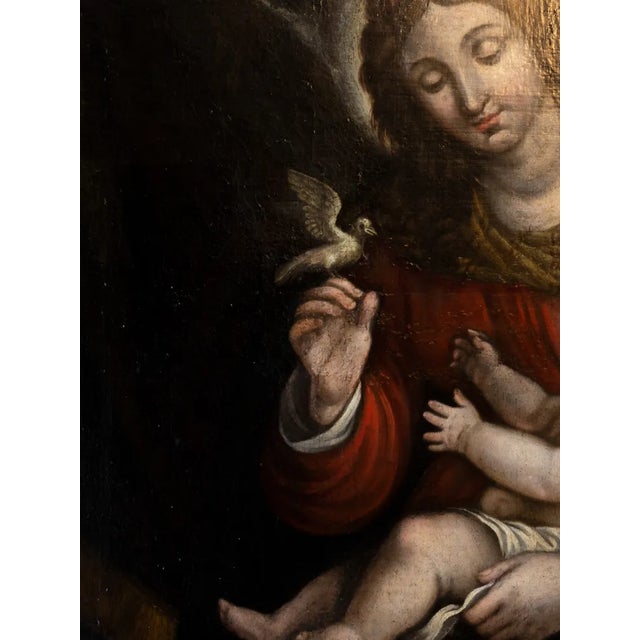 A Renaissance oil painting of Our Lady of Peace, Mary with Jesus Christ, Prince of Peace on her arm in a dark background,...