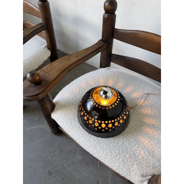 Vintage 1960s ceramic wall sconce in the style of George Pelletier's designs. Round shape, with the socket housing a...