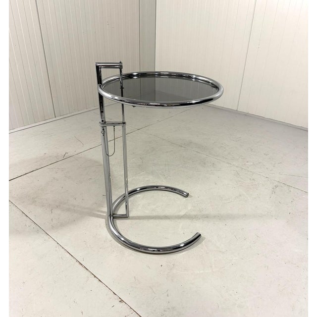 Adjustable side table e1027 by eileen gray, vereinigte werkstätten, germany (marked). the vereinigte werkstätten produced...