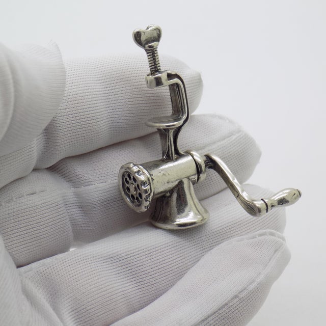 A wonderfully nostalgic vintage miniature depicting a traditional tomato milling machine, handcrafted in Italy during the...