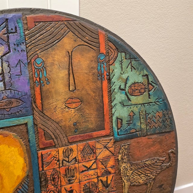 Artist Al Masri's paintings incorporate different forms of ancient art and cultural symbols such as inscriptions, pottery,...