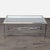 Bronze and gunmetal frame, beveled glass inset top, and decorative curved stretcher base. Brand: Ethan Allen . No makers...
