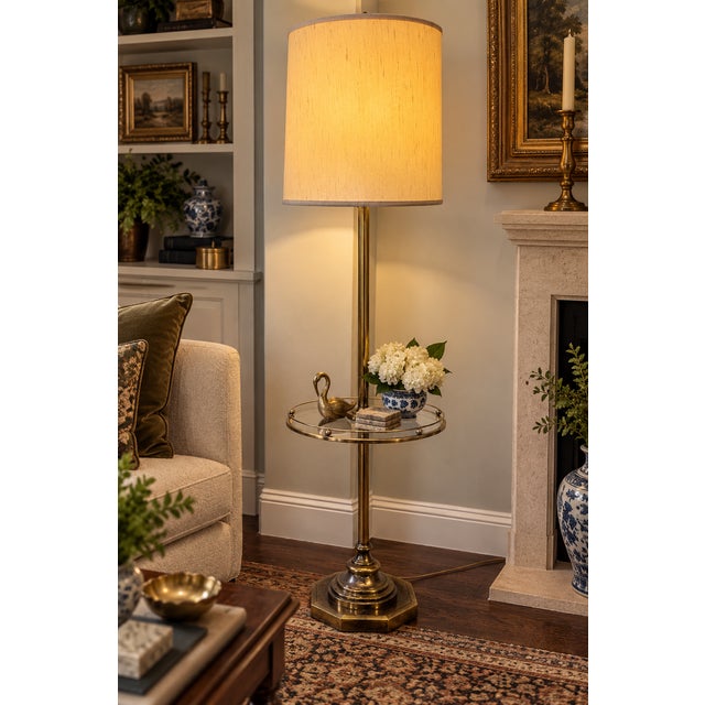 A substantial vintage brass and glass tray-table floor lamp, circa mid-20th century, combining a floor lamp and occasional...