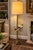 A substantial vintage brass and glass tray-table floor lamp, circa mid-20th century, combining a floor lamp and occasional...