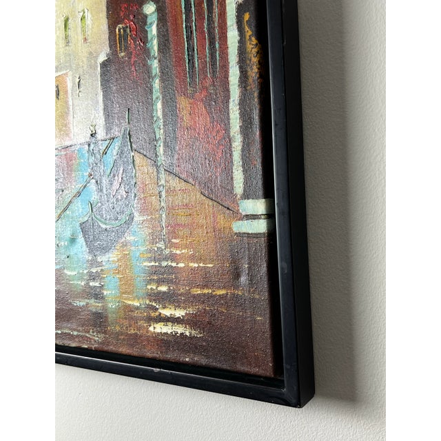 Framed acrylic impasto painting of gondolier on Venice canal. Heavy canvas on wooden stretcher. Black lacquered foam...