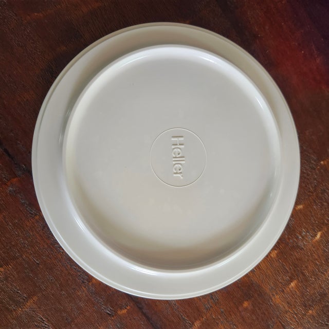 The Heller Massimo Vignelli Set of Stackable Plates And Trays in blue, red, and white features a stylish design inspired...