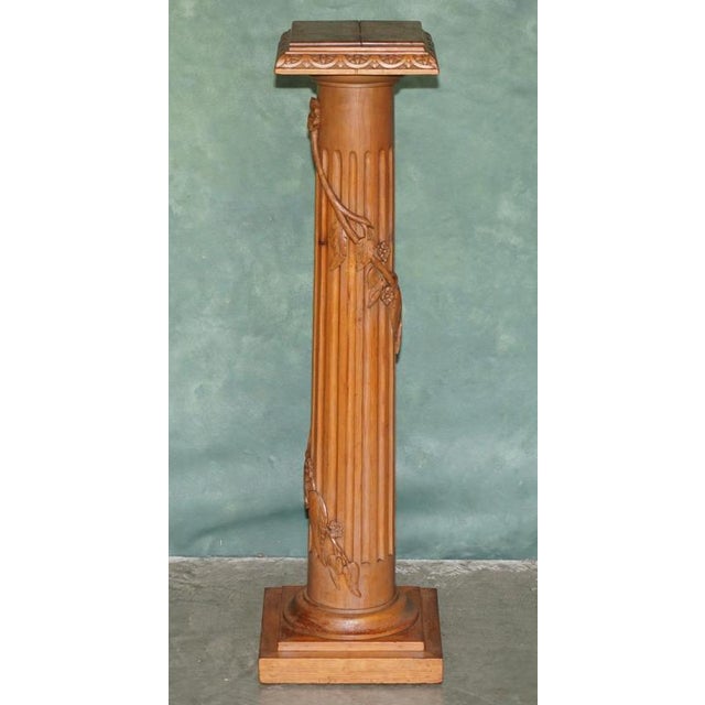 Exquisite hand made in England Tiger Oak jardinière stand with carved vine leaf detailing Please note: The delivery fee...