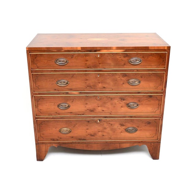 A gorgeous antique Regency style inlaid yew wood chest of drawers. This was made in England, we would date it to around...