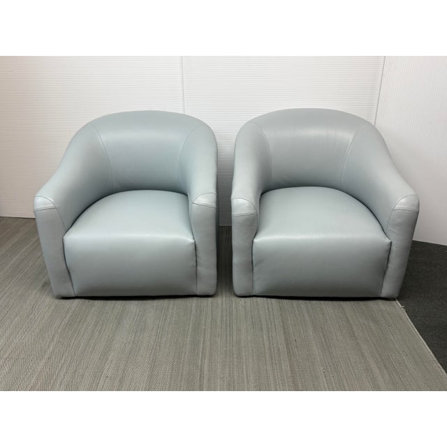 Design Plus Gallery Presents a Pair of A. Rudin Leather Swivel Chairs. The chairs are model 419 barrel back with slope...