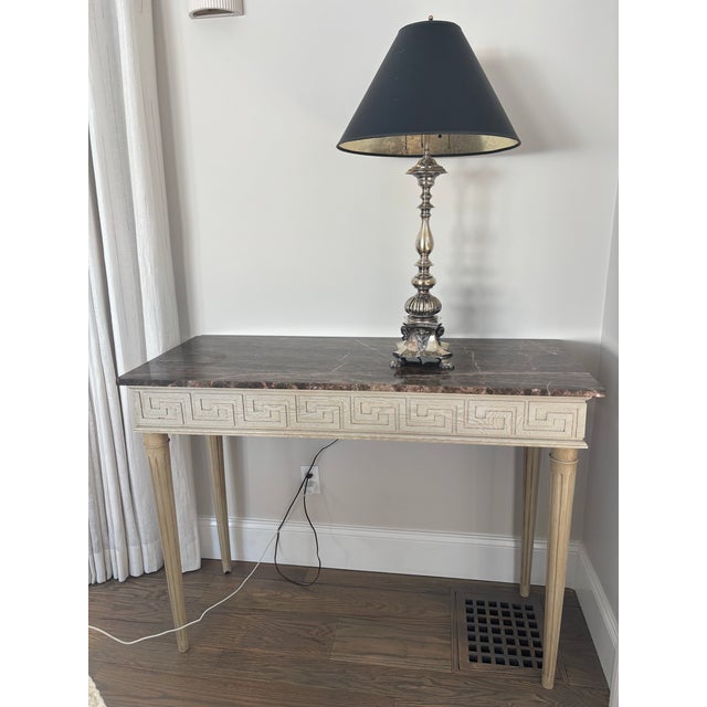 Silver plated lamp w gargoyles on all four sides and beast feet. Quite heavy. Black paper shade w silver lining. Our...