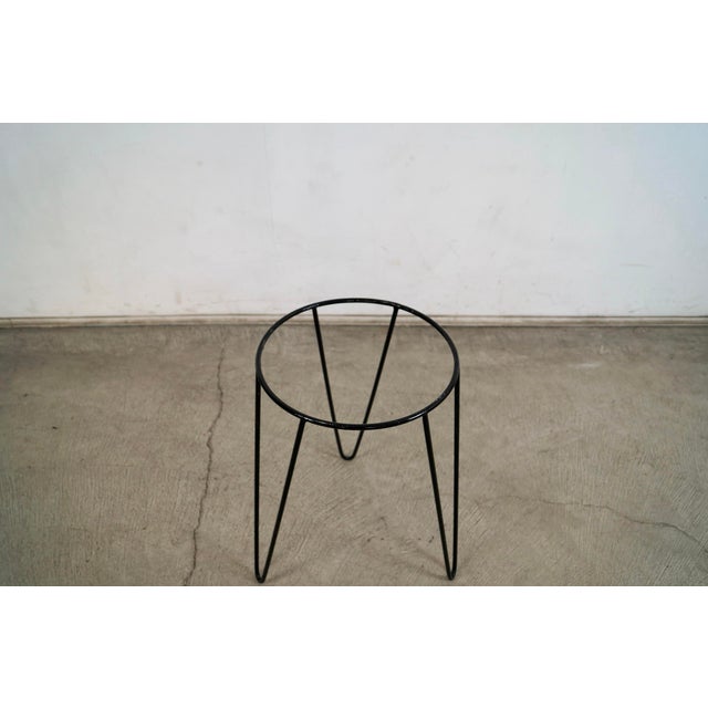 1950's Mid century Modern hairpin plant stand for sale. It's made of iron, and has the a nice black finish. It's solid and...