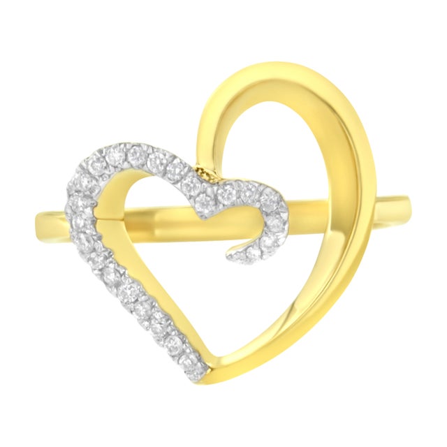 Surprise her with this romantic Diamond Heart Ring, a perfect symbol of love. This modish heart ring showcases 24...
