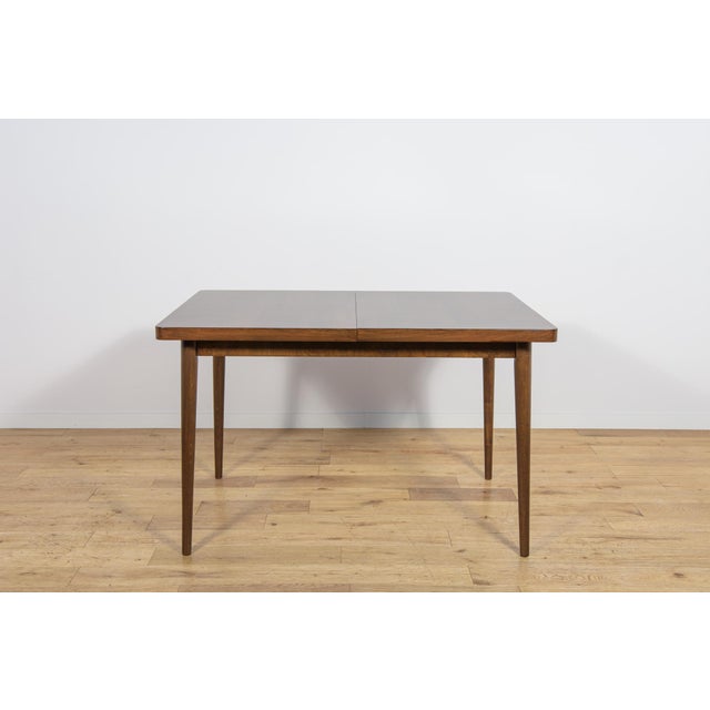 This extendable table was designed by Bohumil Landsman and Hubert Nepozitek in the 1960s. It was manufactured by the...