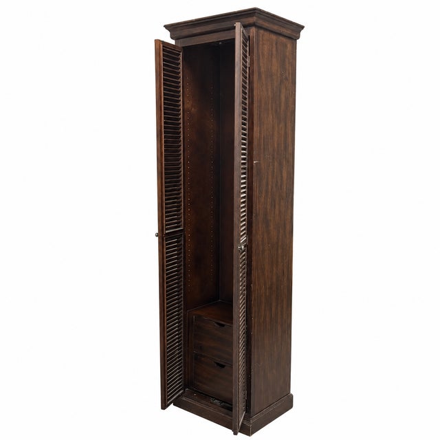 Design Plus Gallery presents the Reclaimed Wood Two-Door Louvered Storage Cabinet. The tall wood frame is detailed with a...