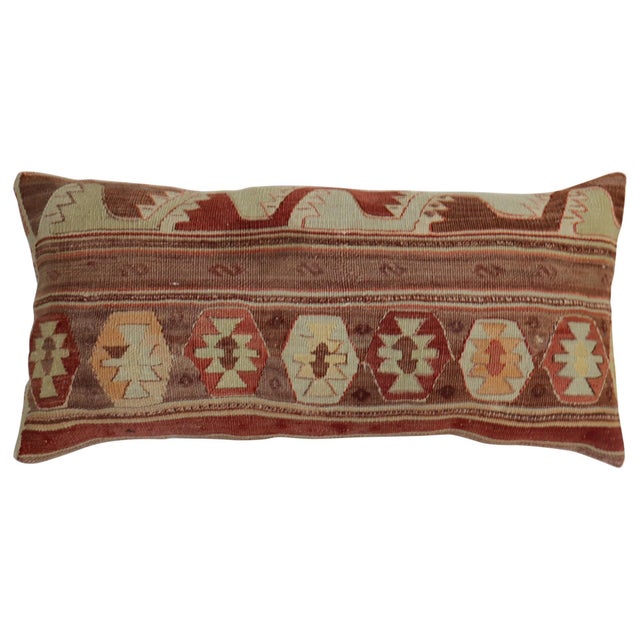 Larger bolster size pillow made from a vintage Turkish Kilim flat-weave. Measures: 16” x 34”.