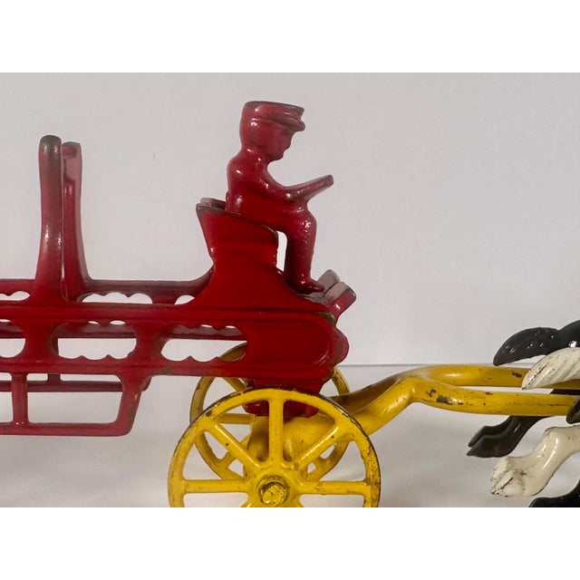 Rare & Original Vintage Cast Iron Horse Drawn Fireman Ladder Wagon Toy for your consideration. The toy measures approx. 11...