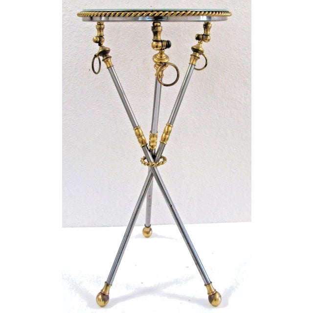 The Italian Neoclassical Tripod Drinks Table is a stylish and elegant piece of furniture perfect for serving drinks in...
