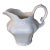 A Beautifully Sculpted, Glossy White Ceramic Pitcher. For Sale
