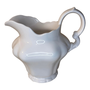 A Beautifully Sculpted, Glossy White Ceramic Pitcher.