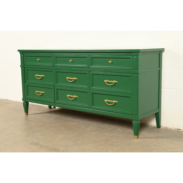 An exceptional French Regency Louis XVI style nine-drawer triple dresser or credenza By White Furniture Co. USA, Circa...