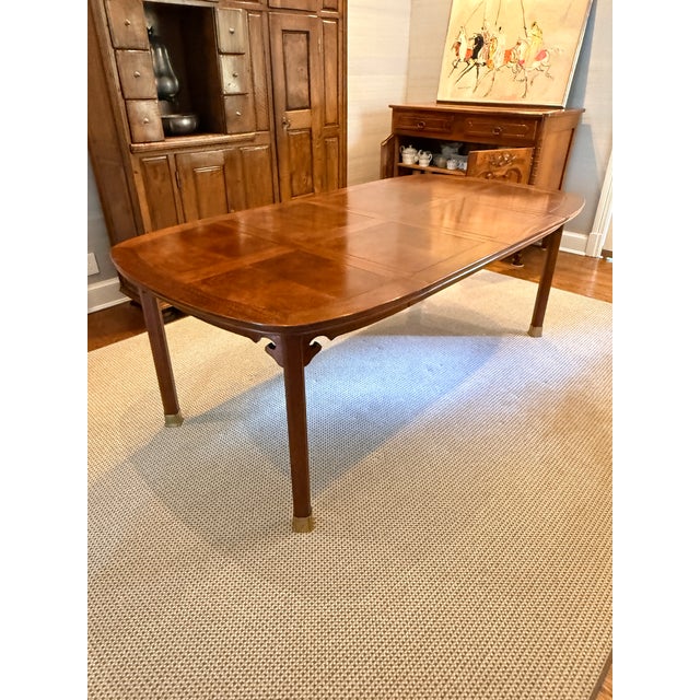 Expandable Burl Walnut Dining Table A great-looking table with mid century character. The rounded ends on this rectangular...