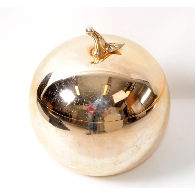 Superb ice bucket in the form of a apple, the 24k gold plated over Nickel body with removable lid complete with...