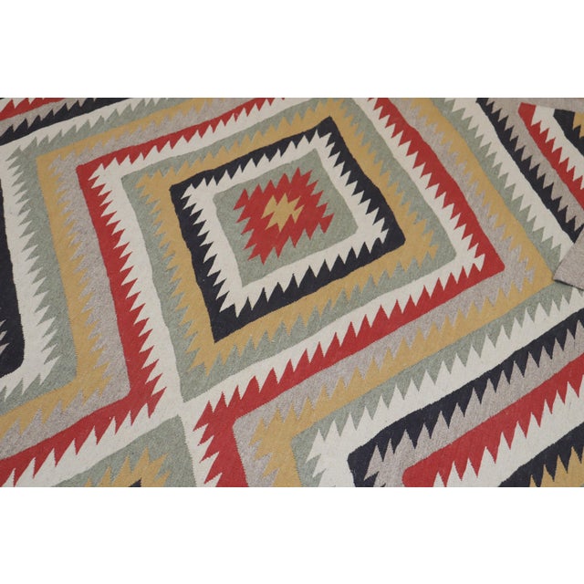 A high decorative one of a kind room size Persian Reproduction rug derived from an American Navajo rug with an all-over...