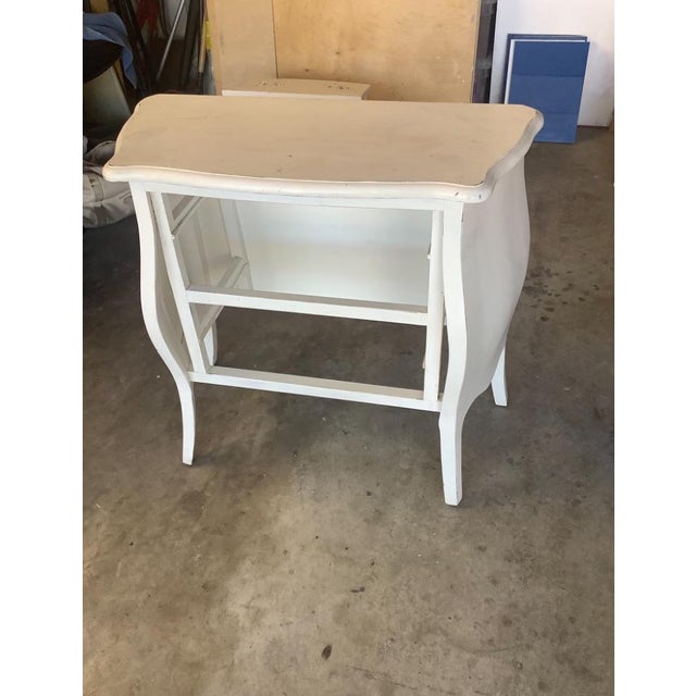 A charming vintage French Provincial chest with classic Louis XV-inspired curves. Crafted of solid wood, the two-drawer...