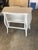 A charming vintage French Provincial chest with classic Louis XV-inspired curves. Crafted of solid wood, the two-drawer...